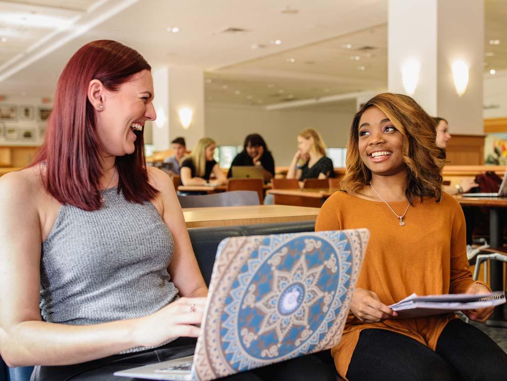 Two students talking in University Student Center